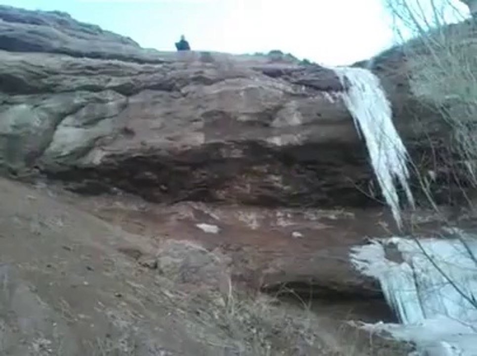 Dumb guy falling from the top of a cliff!