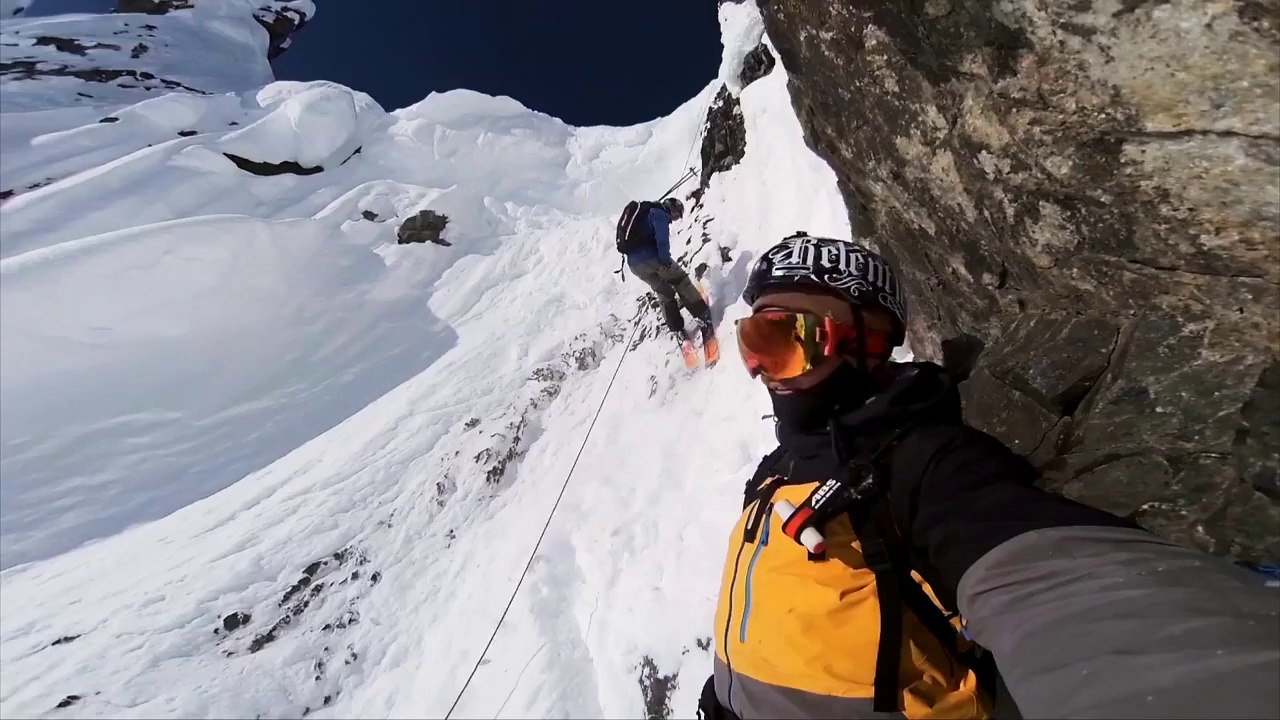 Riders climbing mountain before an awesome snowboard session!