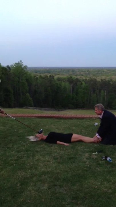A guy plays Golf on a girl mouth. Crazy Swing!