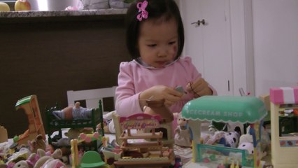 Girl And Sylvanian Families