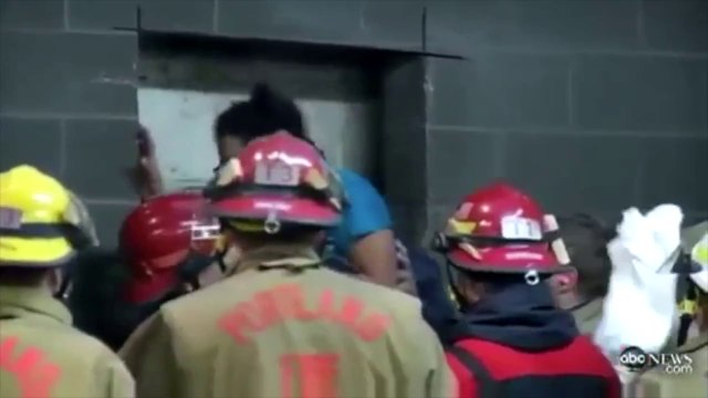 Portland woman trapped between two buildings