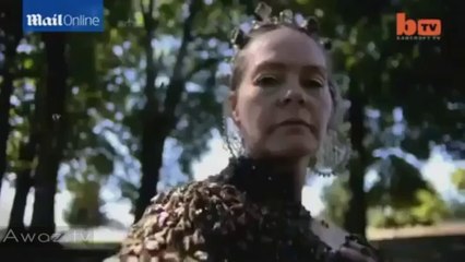 Woman WEARS 12,000 BEES on her naked chest
