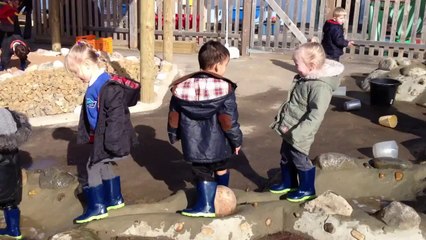 Children Having Fun with Flow Puddles