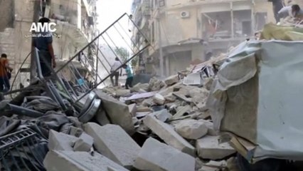 Aleppo shrouded in smoke in aftermath of explosive barrels