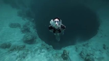 Guillaume Nery base jumping at Dean's Blue Hole, filmed on breath hold by Julie Gautier