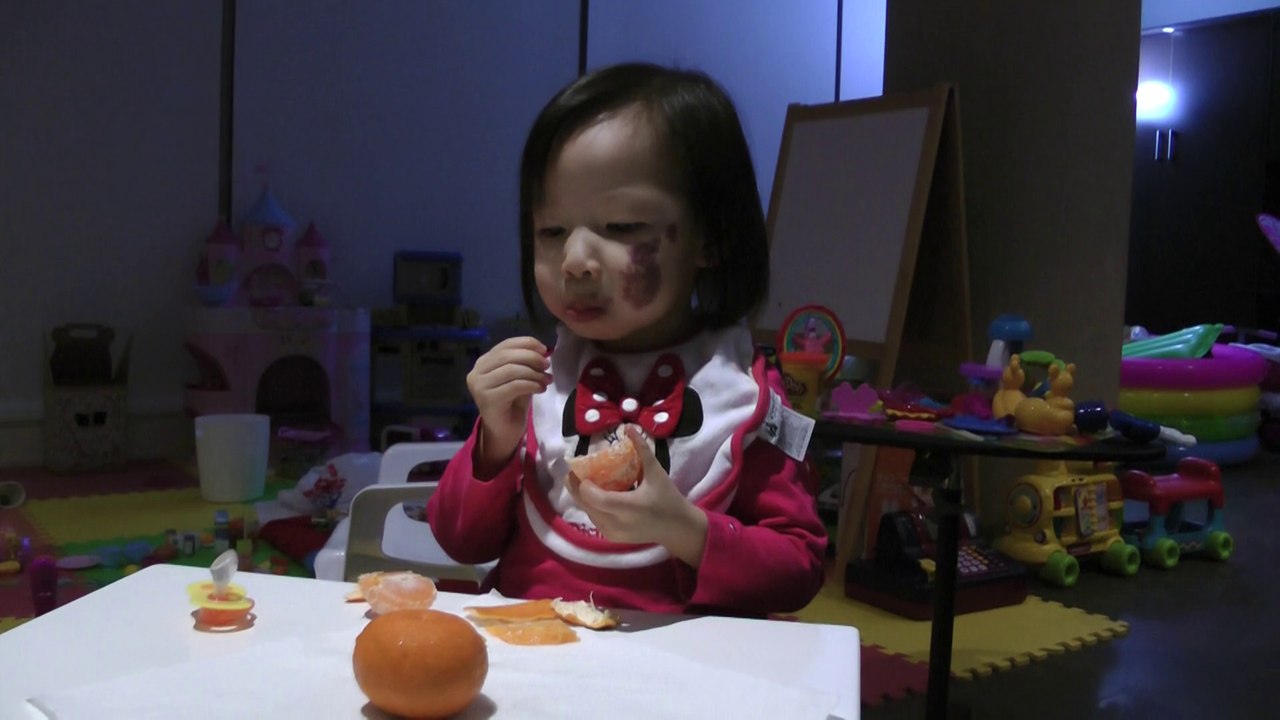 Girl Eating Orange