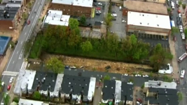 Giant sinkhole swallows cars and train tracks in Baltimore