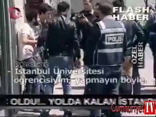 Eylemciye zorla poşu takan polis