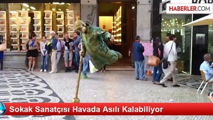 Sokak Sanatçısı Havada Asılı Kalabiliyor