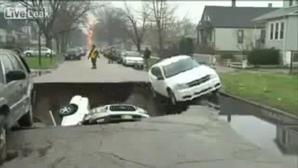 during rain a big whole on the road and cars are drop into that whole.