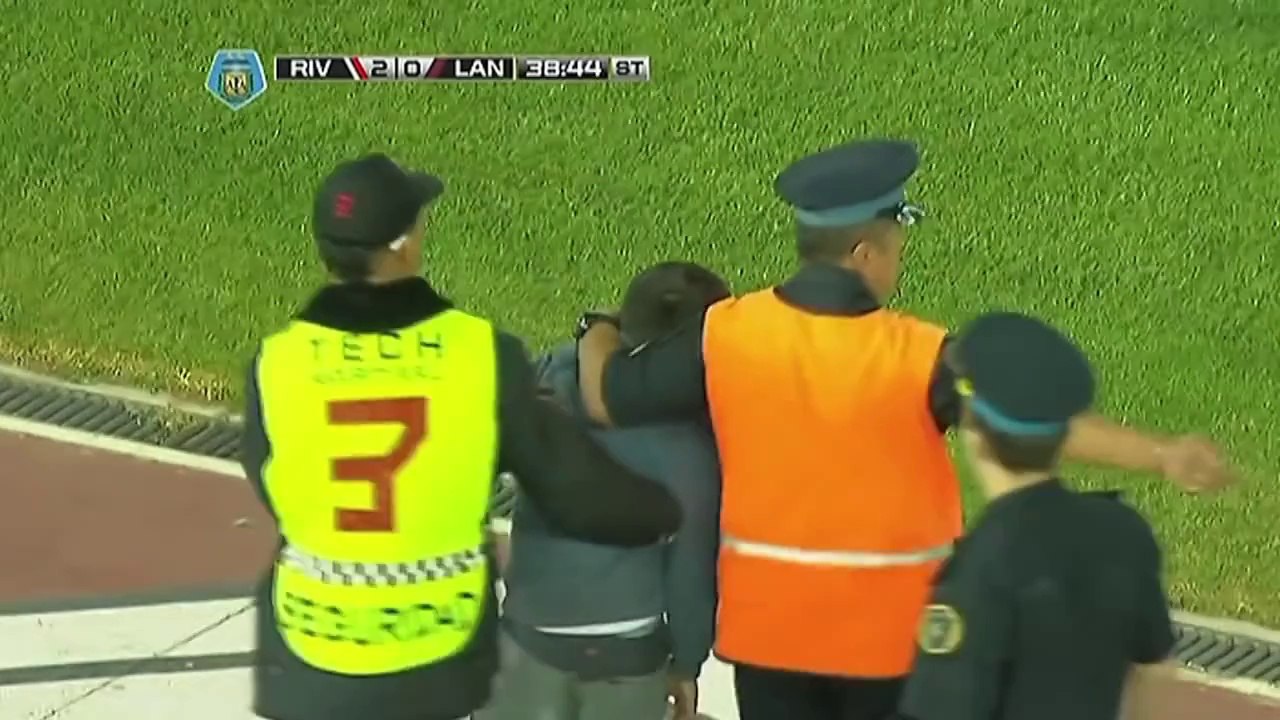 Young boy invades pitch and runs rings round stewards!