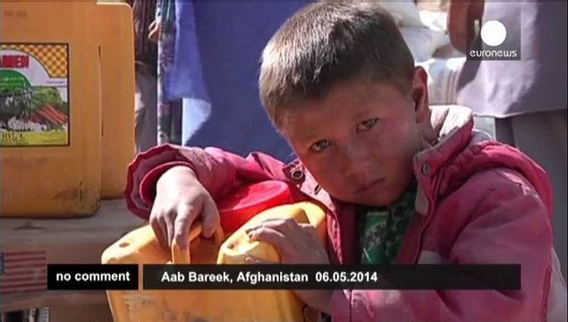 Afghan President Hamid Karzai visits landslide victims