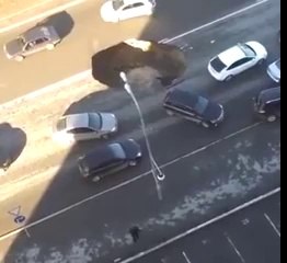 Watch Russian Road Slowly Cave in and Reveal Huge Sinkhole