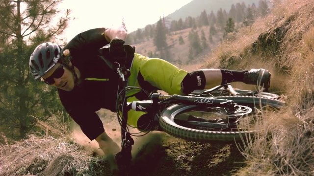 Mountain Biker Demonstrates Extreme Parallel To The Ground Turn