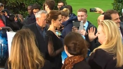 Jolie hits the red carpet; Perry sings