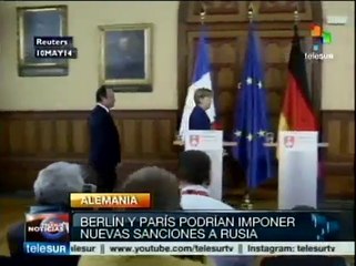 Merkel y Hollande anuncian sanciones económicas a Rusia