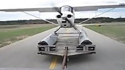 Sea plane takes off from a truck bed