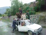 World Record in Chitral BY Rahmat wali (34 People Seat on Alto Car)