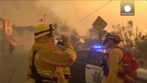 Thousands flee California wildfires