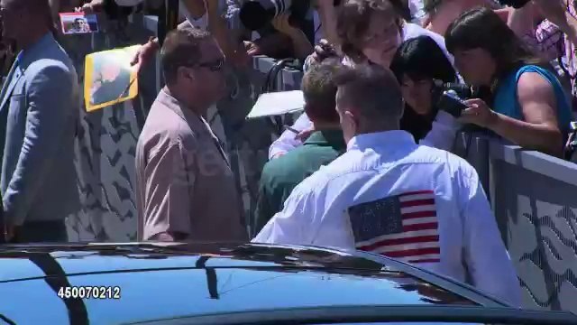Robert Pattinson arriving and signing at The Rover Cannes photocall