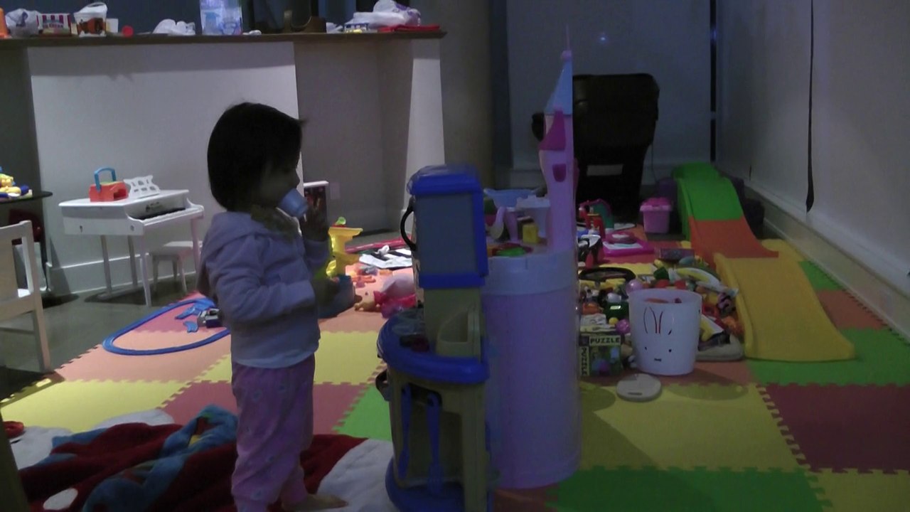 Girl Playing Toy Microwave Oven