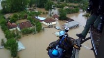 Baby rescued from flood waters in Bosnia