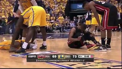 Paul George assommé par le genou de Dwyane Wade