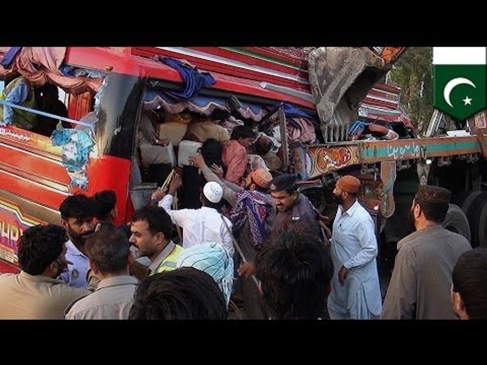 Pakistan bus crash: dozens dead after coach-truck collision