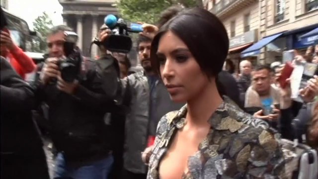 Kim Kardashian wears plunging dress for wedding brunch