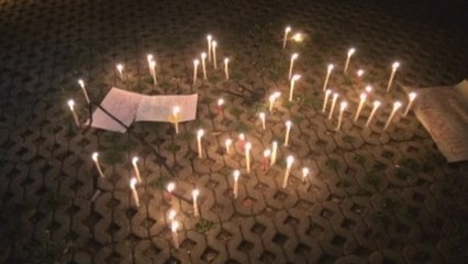 Thais stage candlelight protest against military rule