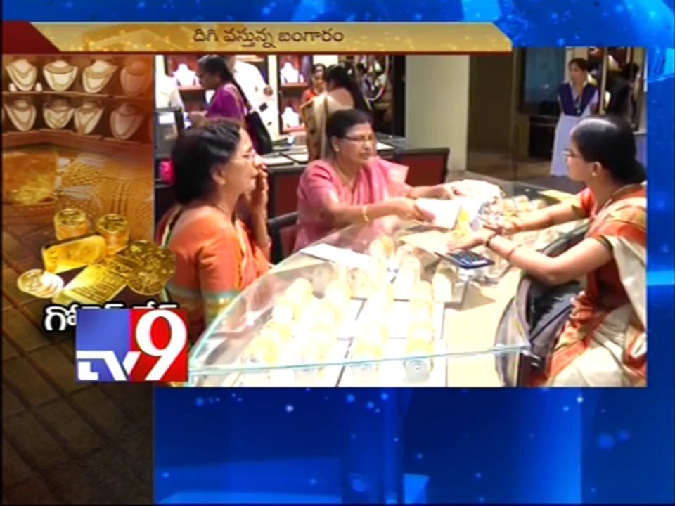 Gold prices climb down as import curbs eased