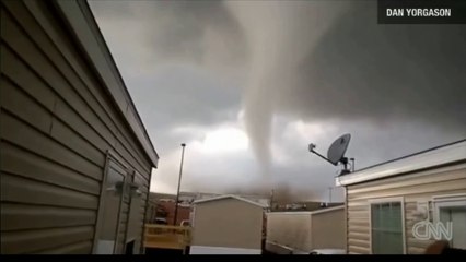 Two men narrowly escape their close encounter with a tornado in North Dakota.