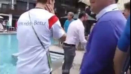 Lukas Podolski throws journalist into pool