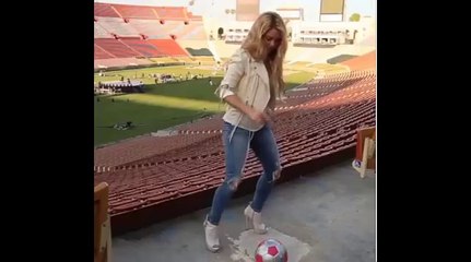 Shakira plays soccer with heels