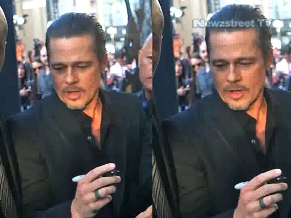 Brad Pitt gets punched by Ukrainian prankster