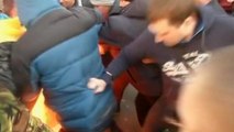 Kiev protesters scuffle with police amid call for prisoners' release