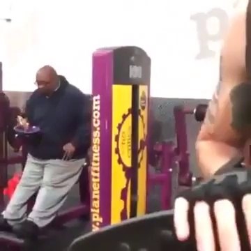 Fat guy eating pizza during his fitness workout!