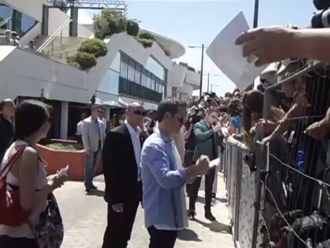 'The Rover' Photocall - Rob Pattinson and Guy signing Autographs