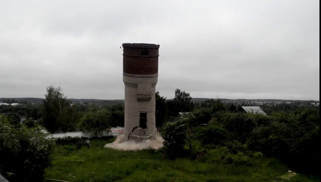 Crazy guys destroying a tower .. Run dude! Run!!!!!