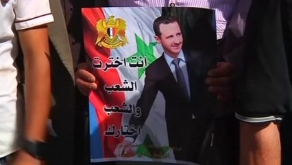 Syrians in Lebanon return home to vote as others protest