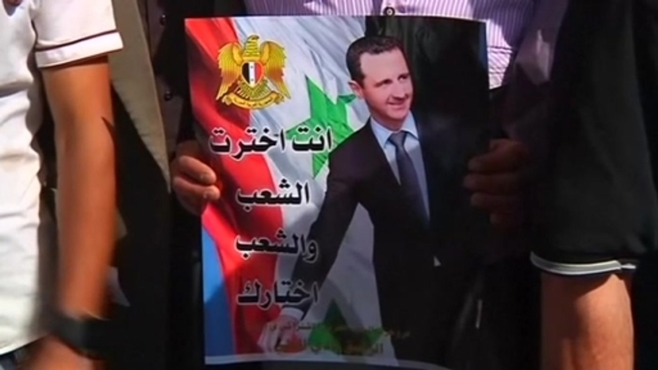 Syrians in Lebanon return home to vote as others protest