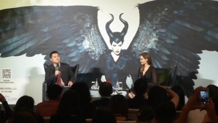 Jolie hits China, Hill apologizes for slur