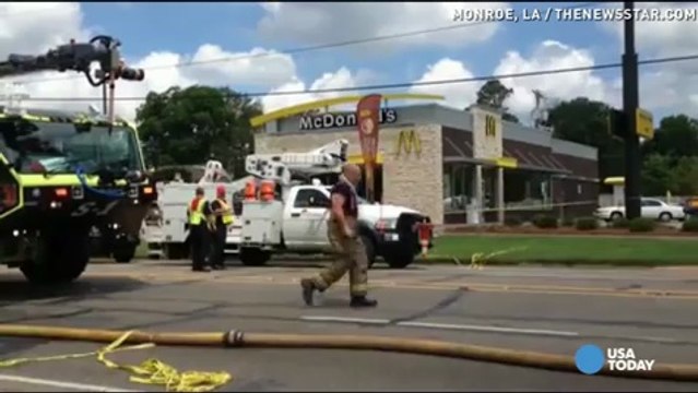 Plane crashes into McDonald's parking lot, pilot lives