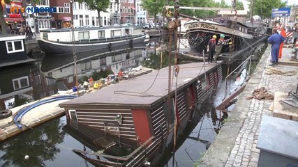 Gezonken woonboot opgetakeld - RTV Noord