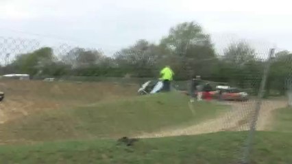 Out of control car goes in the direction of a race marshal and what happens is...