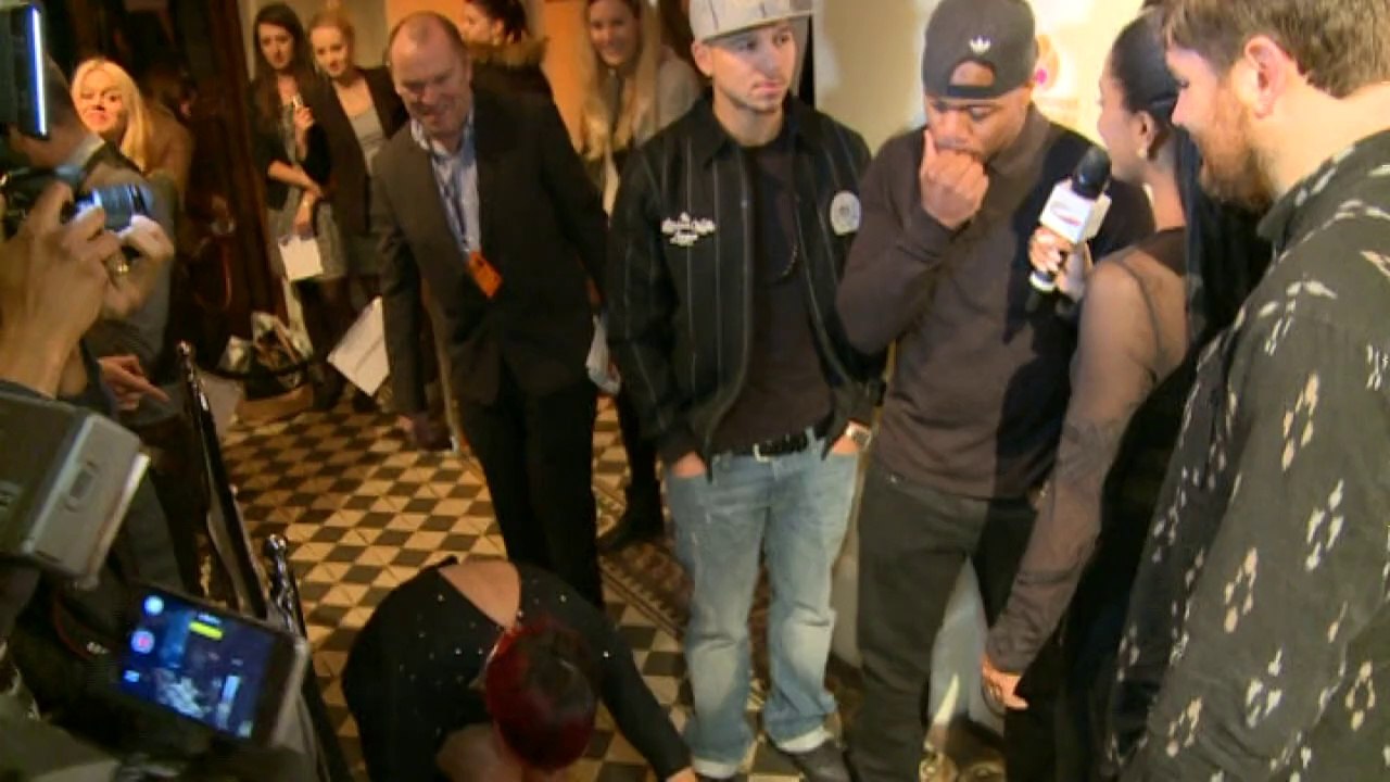 Lily Allen crawls along the floor at charity ball