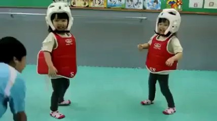 Cute small children wrestling and fighting