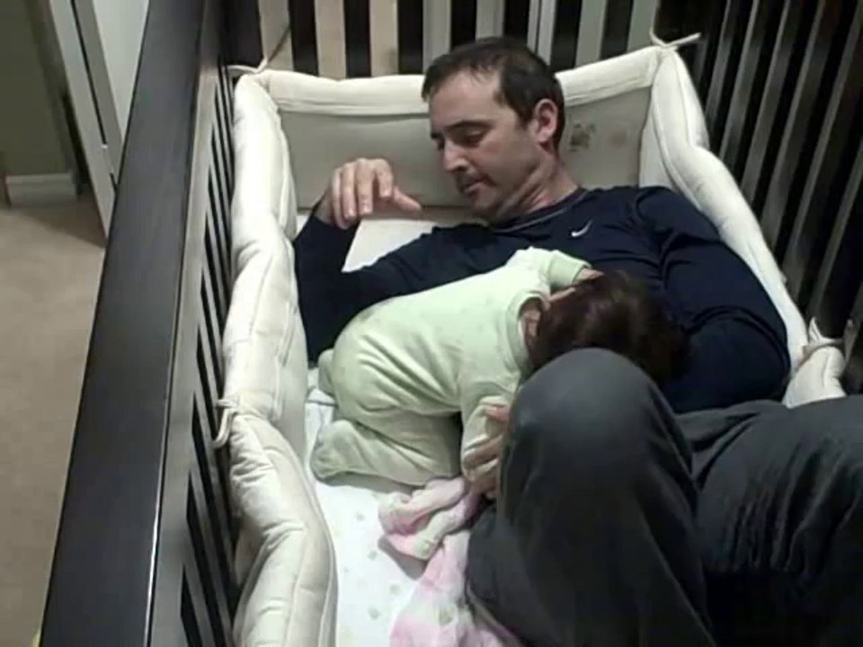 Dad Gets In Crib With His Crying Baby