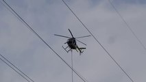 Un hélicoptère coupe des arbres trop proche de lignes électriques!