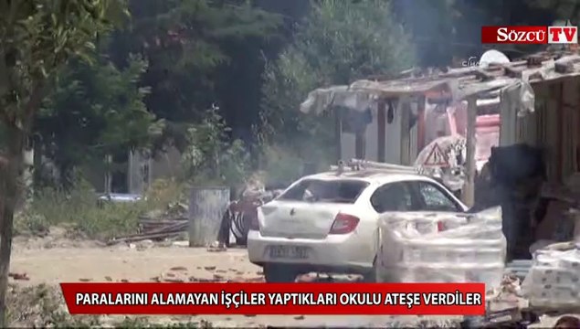 Paralarını alamayan işçiler yaptıkları okulu ateşe verdiler